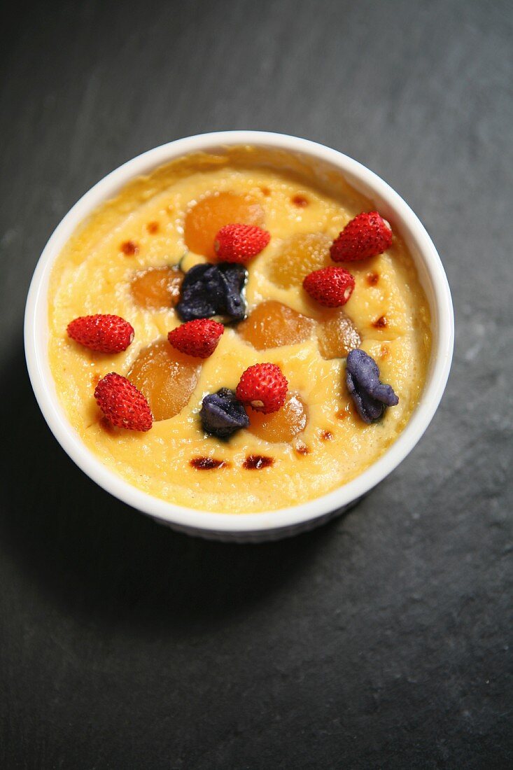 Baked custard with berries and apricots
