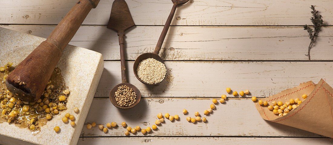 Chickpeas, coriander and sesame seeds in a mortar