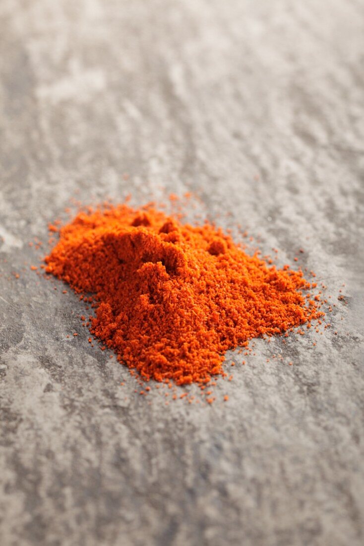 Paprika powder on a grey surface