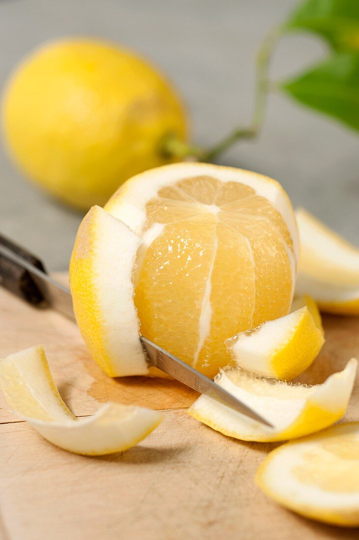 A lemon being filleted