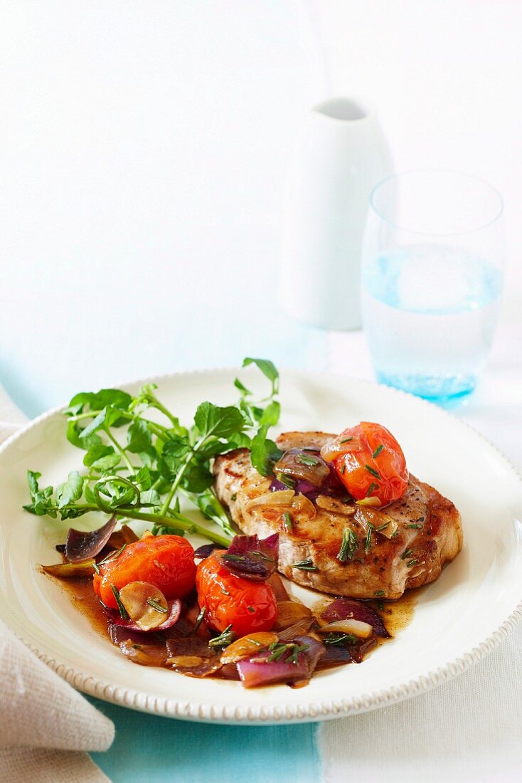 Pork steaks with tomatoes and rosemary