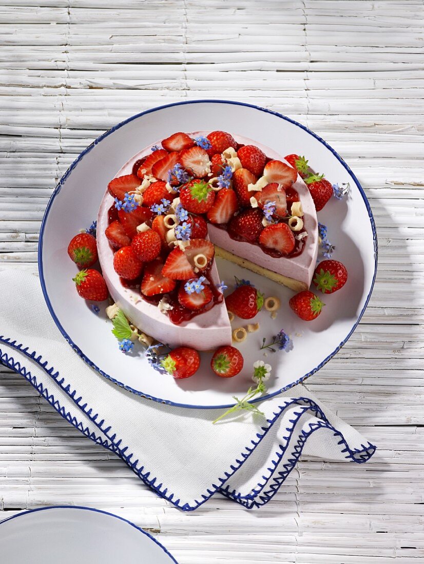 Strawberry cheesecake, partly sliced