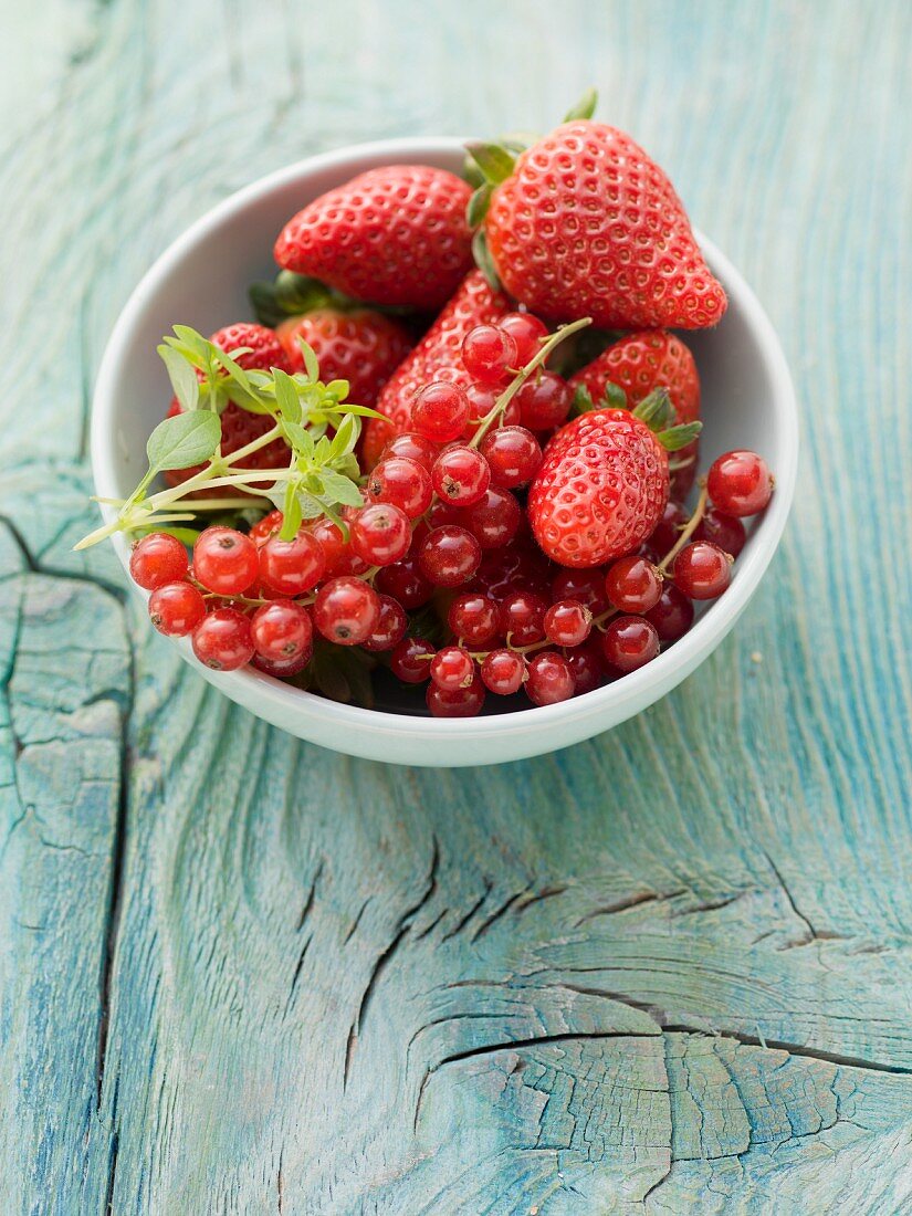 A bowl of strawberries and redcurrants
