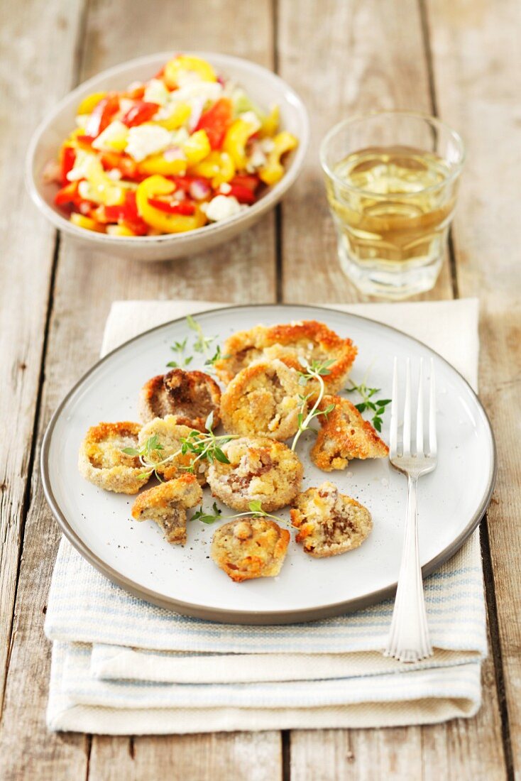 Breaded mushrooms and a pepper salad with feta