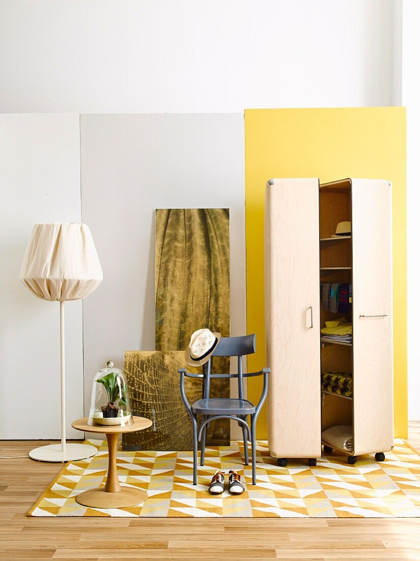 Wardrobe trunk on castors, bentwood chair, standard lamp, side table and bistro chair in cloakroom