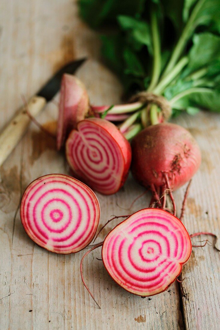 Halved beetroot on a wooden surface