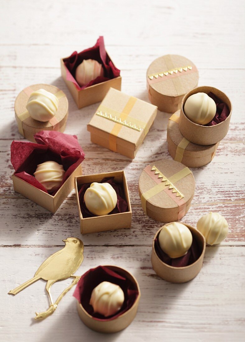 Chocolate pralines in little wooden boxes