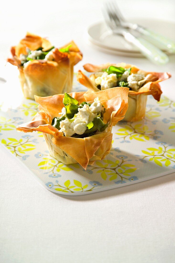 Pastry baskets filled with spinach and feta