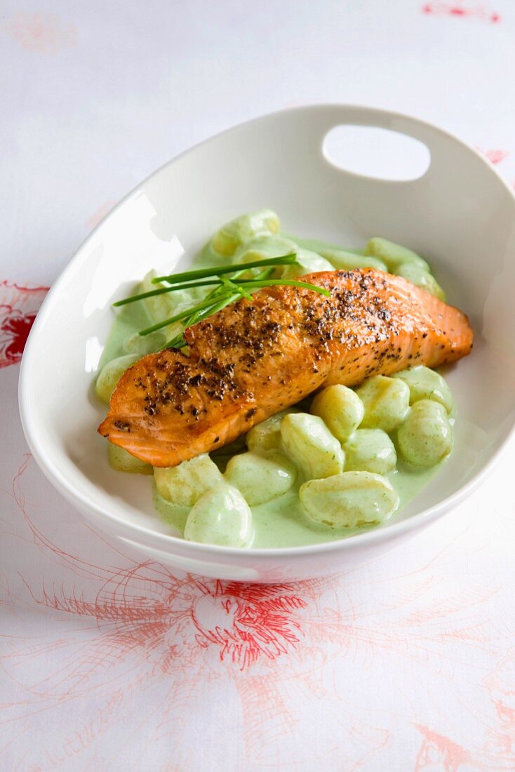 Salmon fillet with gnocchi and a herb & cream sauce