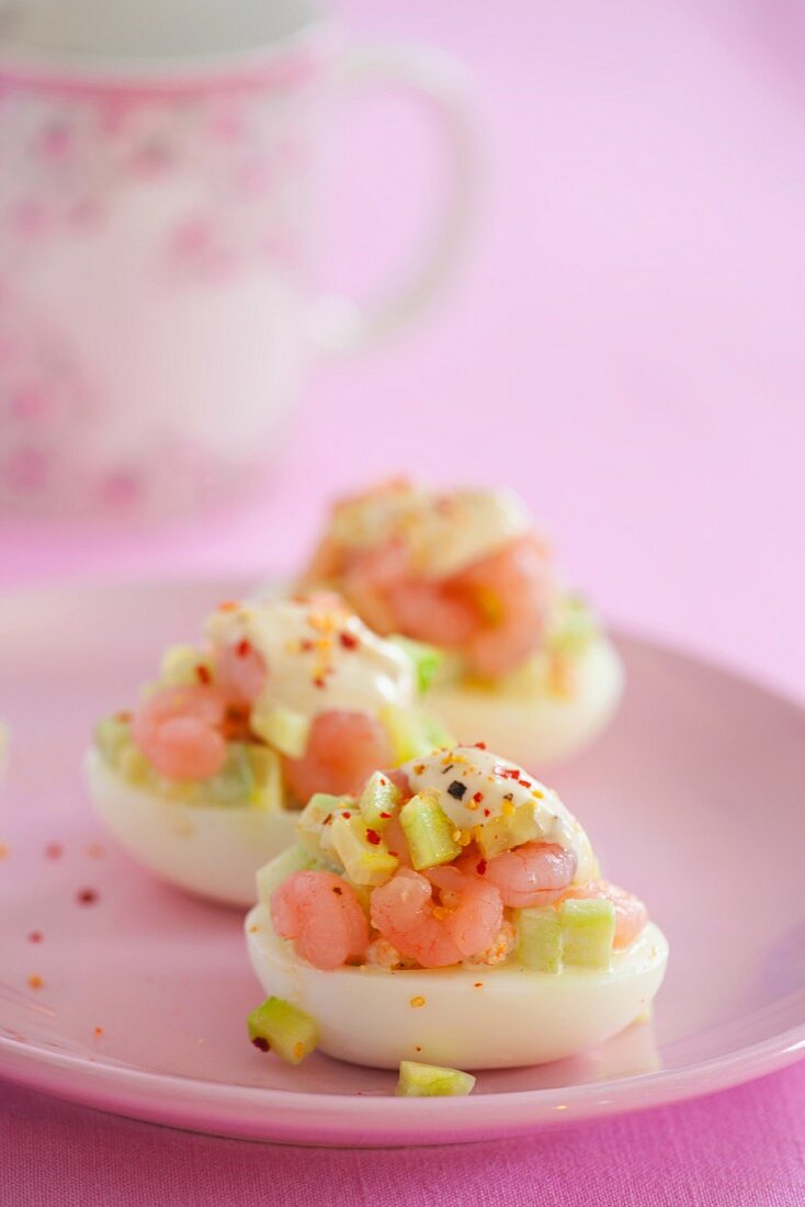 Stuffed eggs with cucumber and prawns