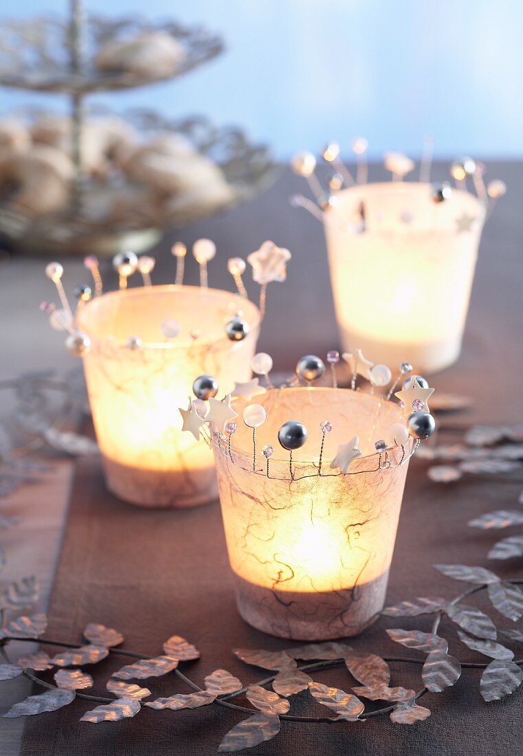 Hand-crafted tealight holders covered in Japanese tissue paper and decorated with beads