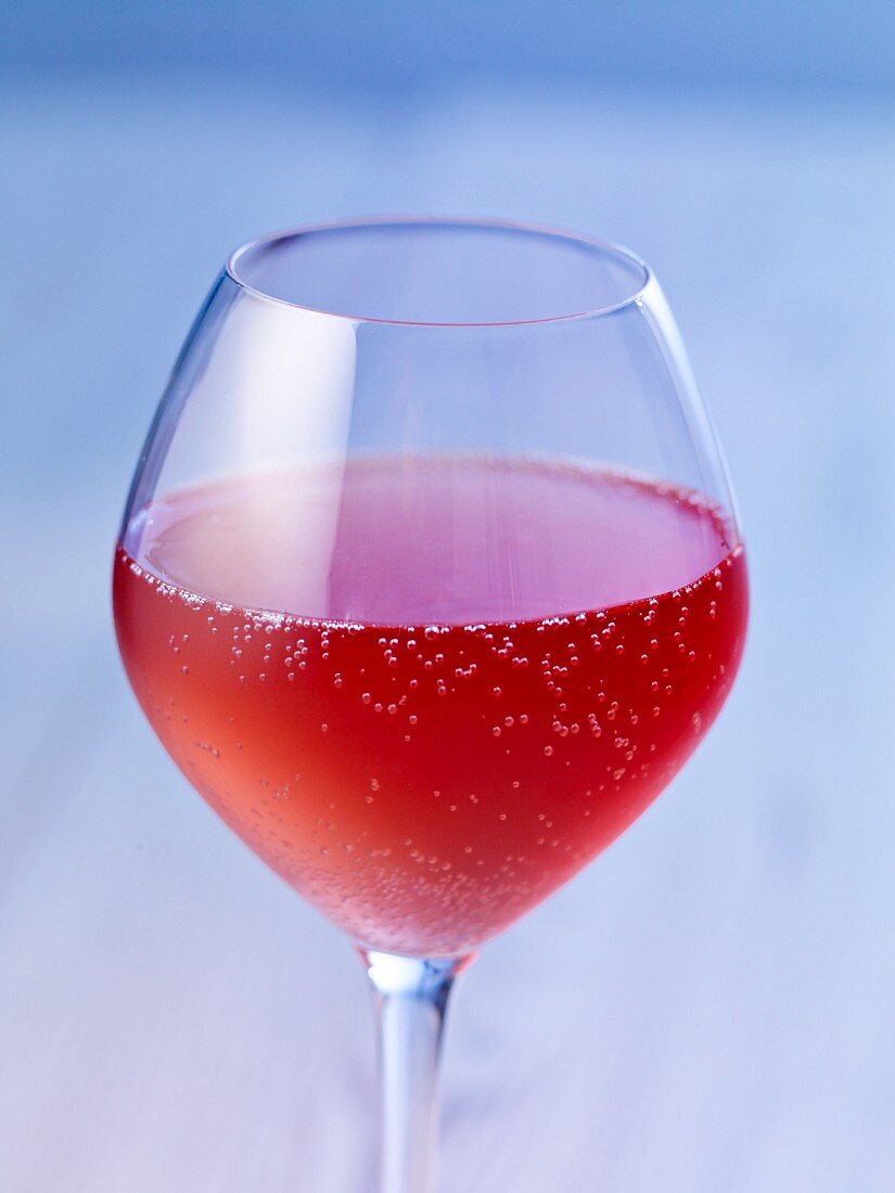 A glass of rosé wine