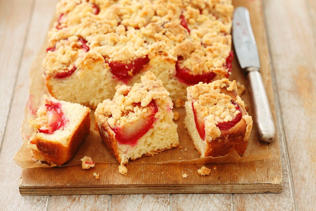 Plum crumble cake, partly sliced