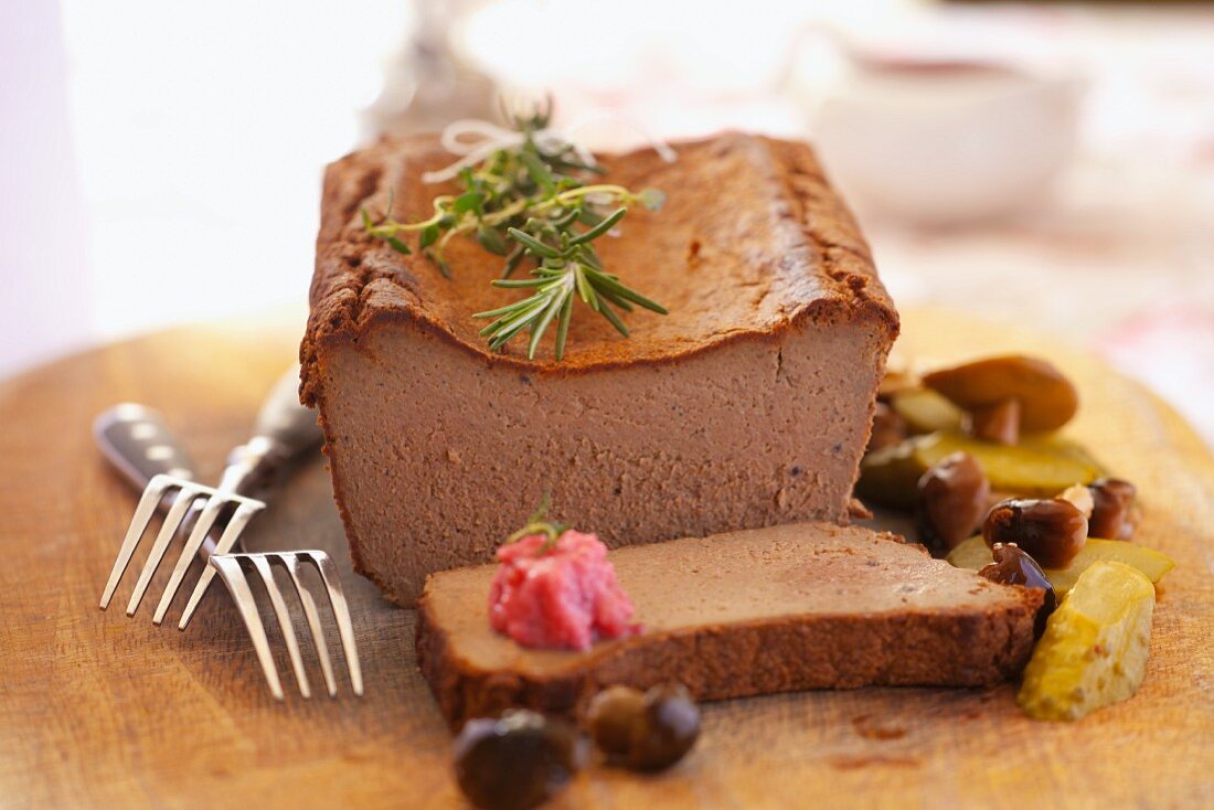 Smooth pâté with pickled vegetables and rosemary