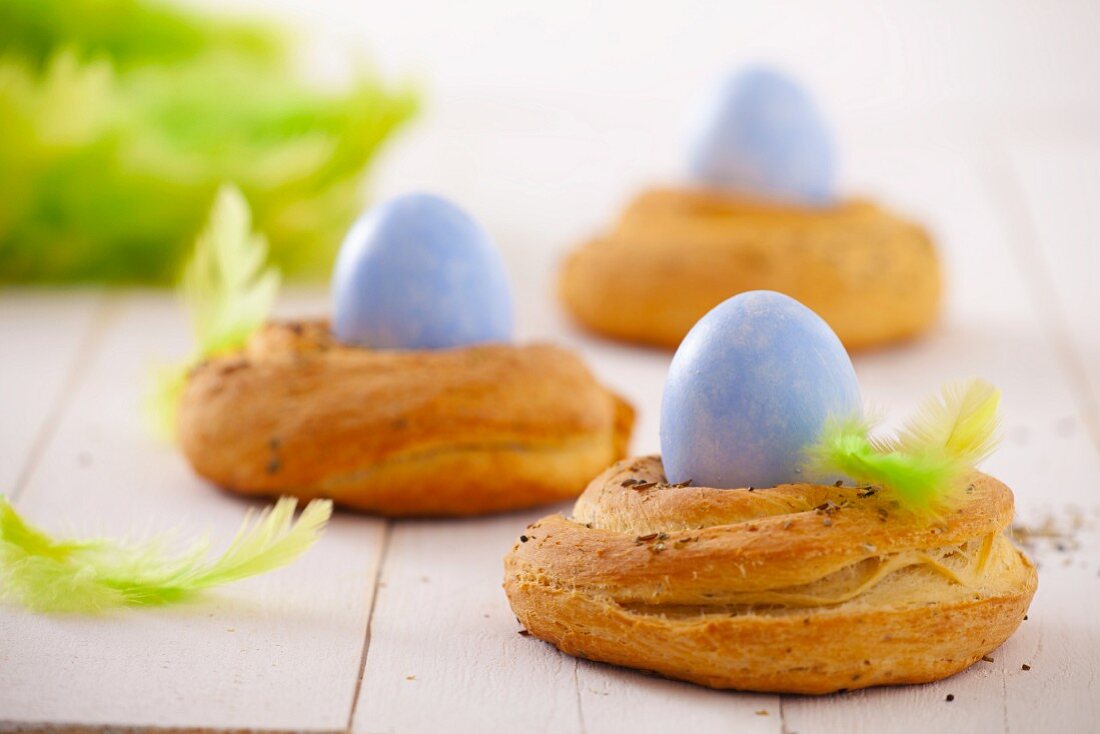 Three yeast baskets with Easter eggs