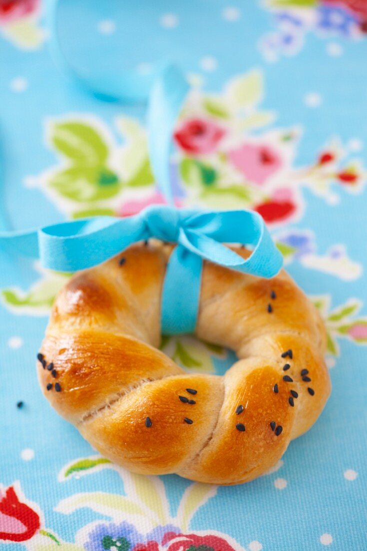 Poppy seeds bagel with tie with ribbon