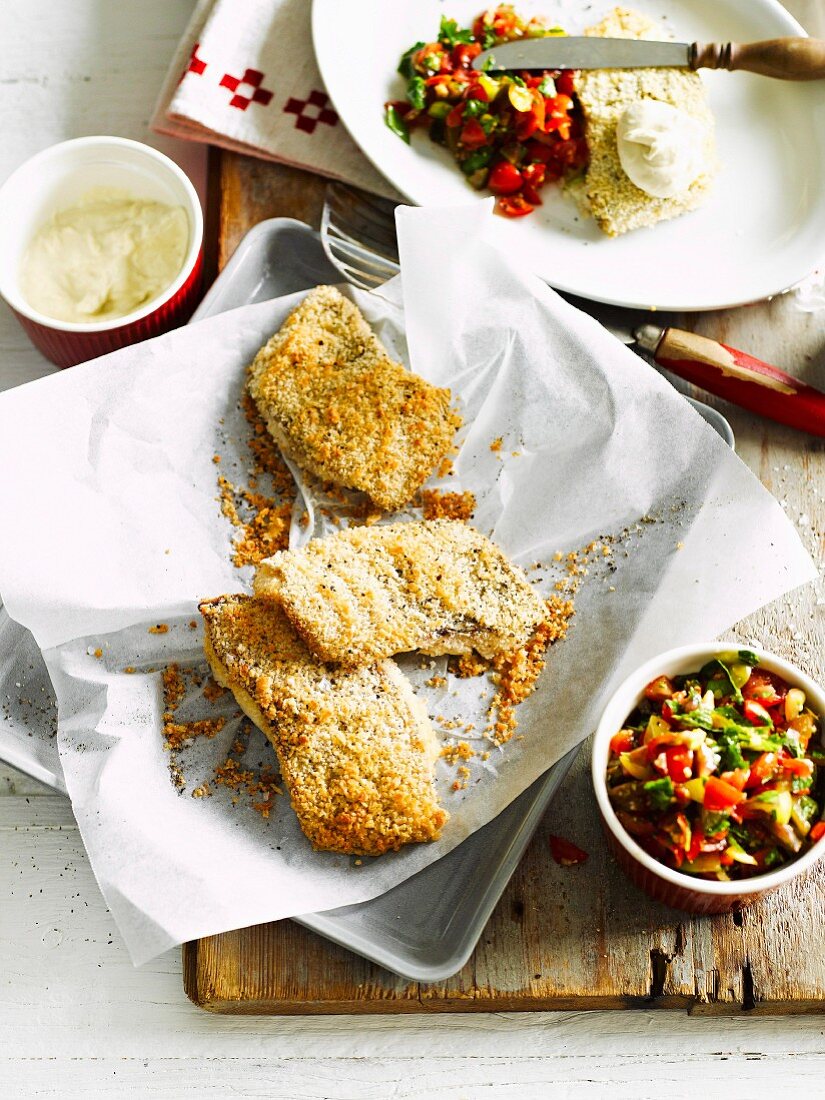 Breaded fish with parsley and mint salad and tahini