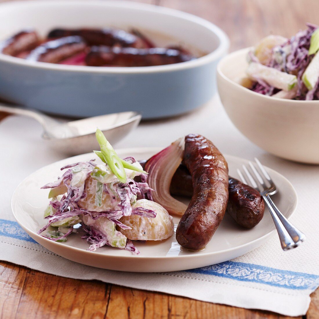 Sausages with a potato & red cabbage salad