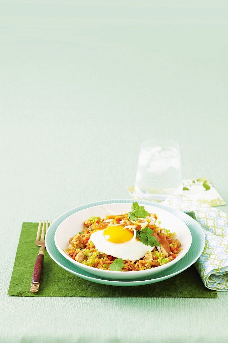 Nasi goreng with satay chicken and a fried egg