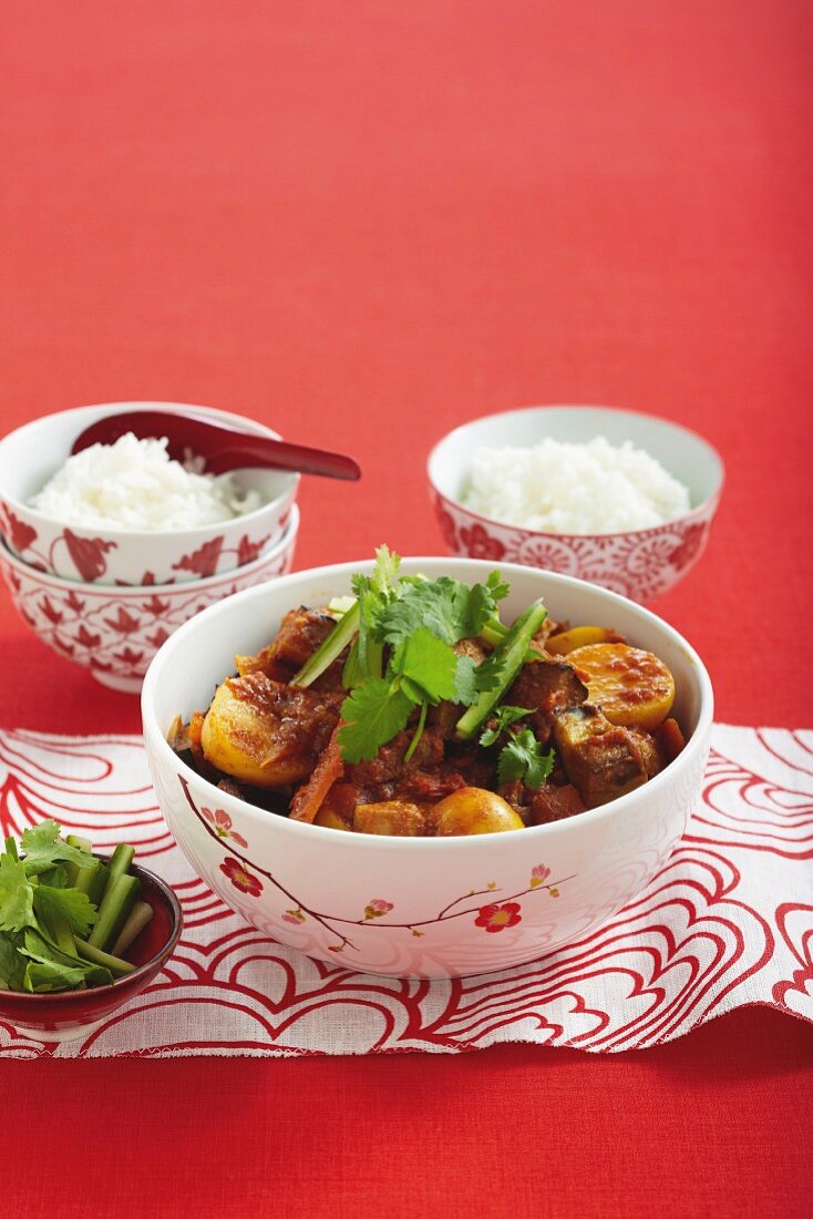 Beef and potato curry with a side of rice