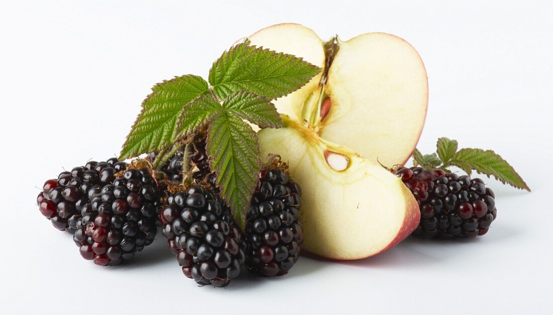 Blackberries and a partly sliced apple