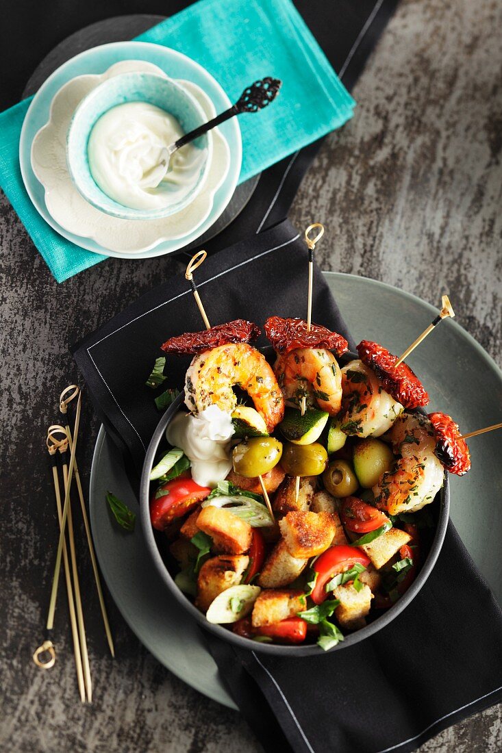 Prawn skewers with bread salad and aioli