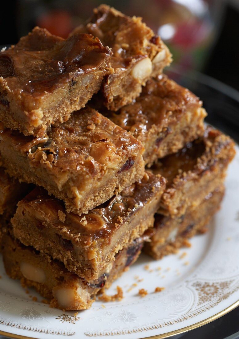 Caramel brownies with macadamia nuts and cranberries