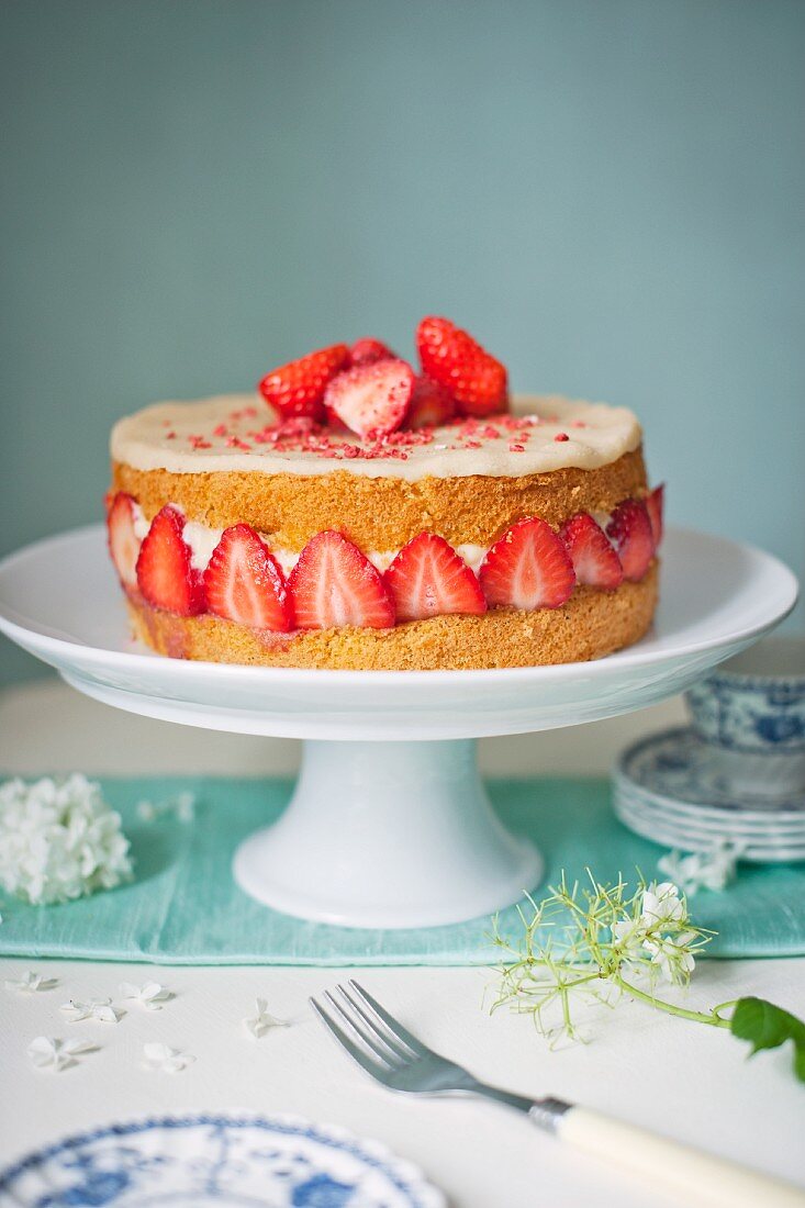 Strawberry Fraisier cake on a cake stand