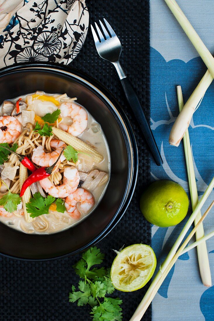 thai curry noodle soup with prawns and fresh lime