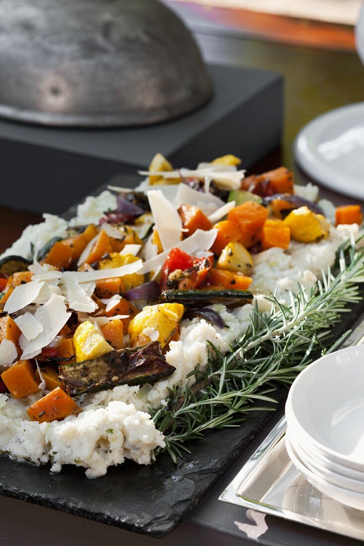 Corn pudding with sage and onion served with oven-roasted vegetables