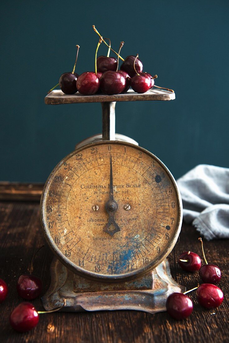 Antique weighing scales with cherries