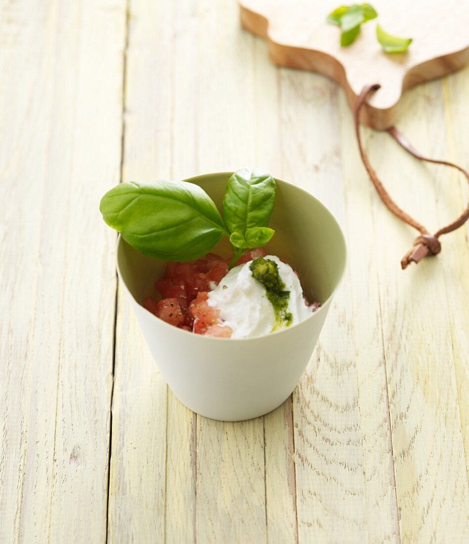 Tomato relish with a goat's cheese cream and basil