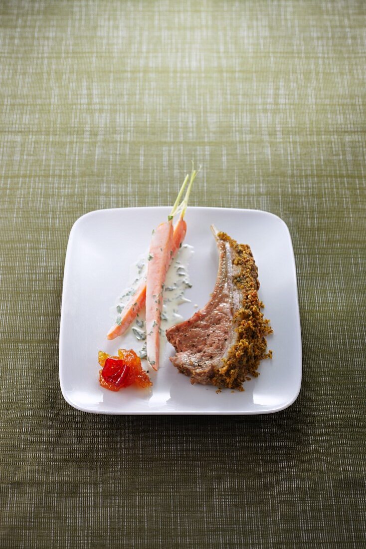 Lamb chop with a herb crust and carrots