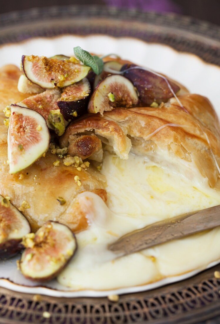 Pastry Wrapped Baked Brie with Figs and Honey; Sliced