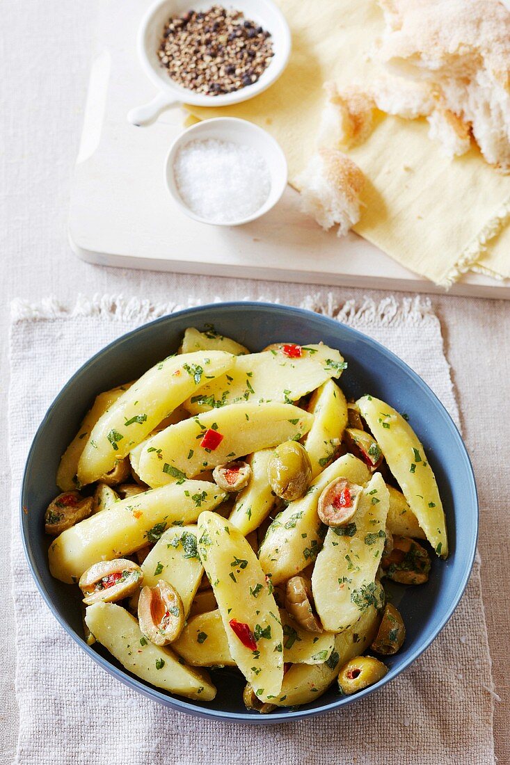 Warm potato salad with mustard and olives