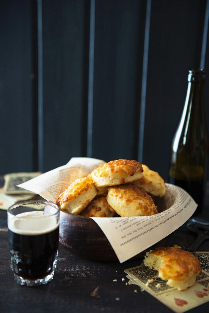 Cheese-topped bread rolls and beer