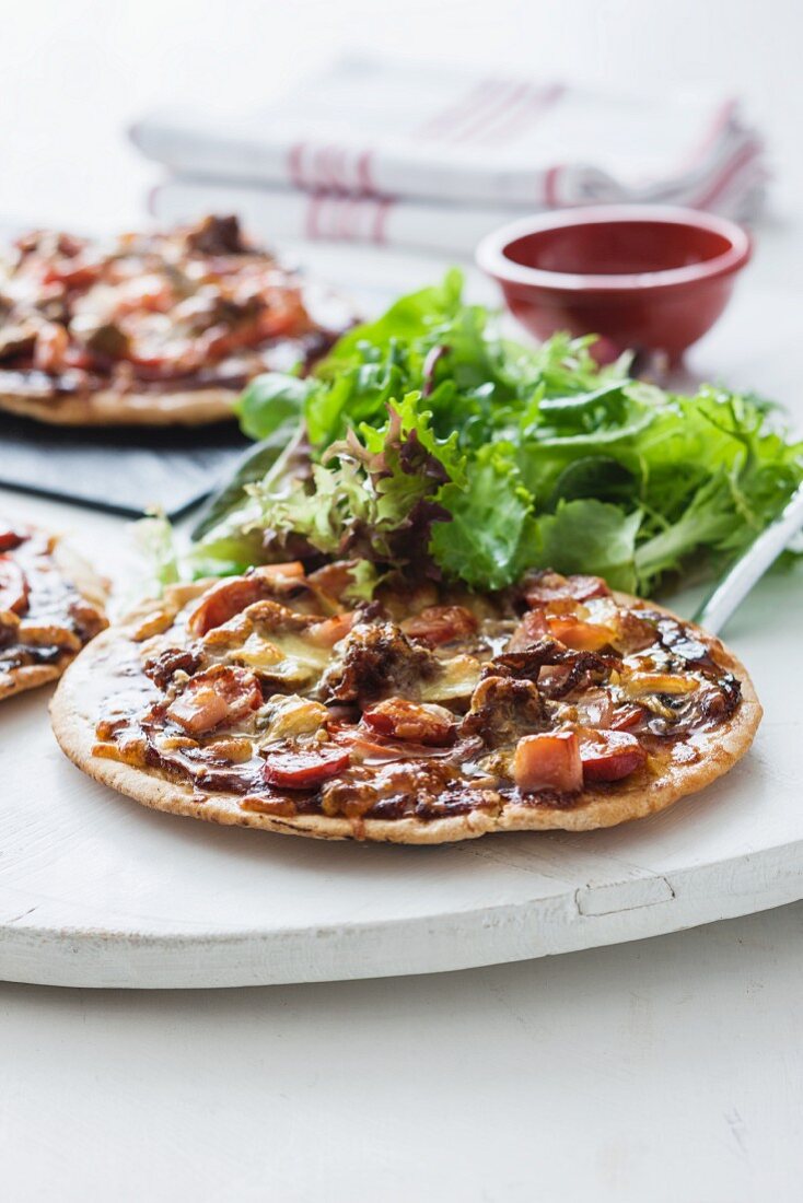 Flatbread pizza with sausage and meat