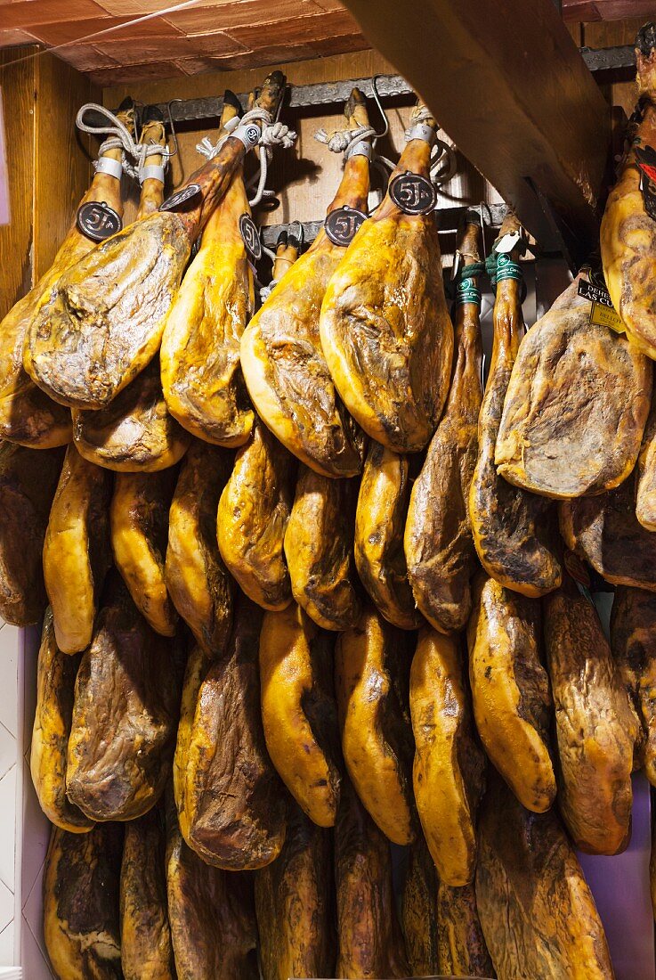 Spanish hams hanging up at the market (Palma, Majorca)