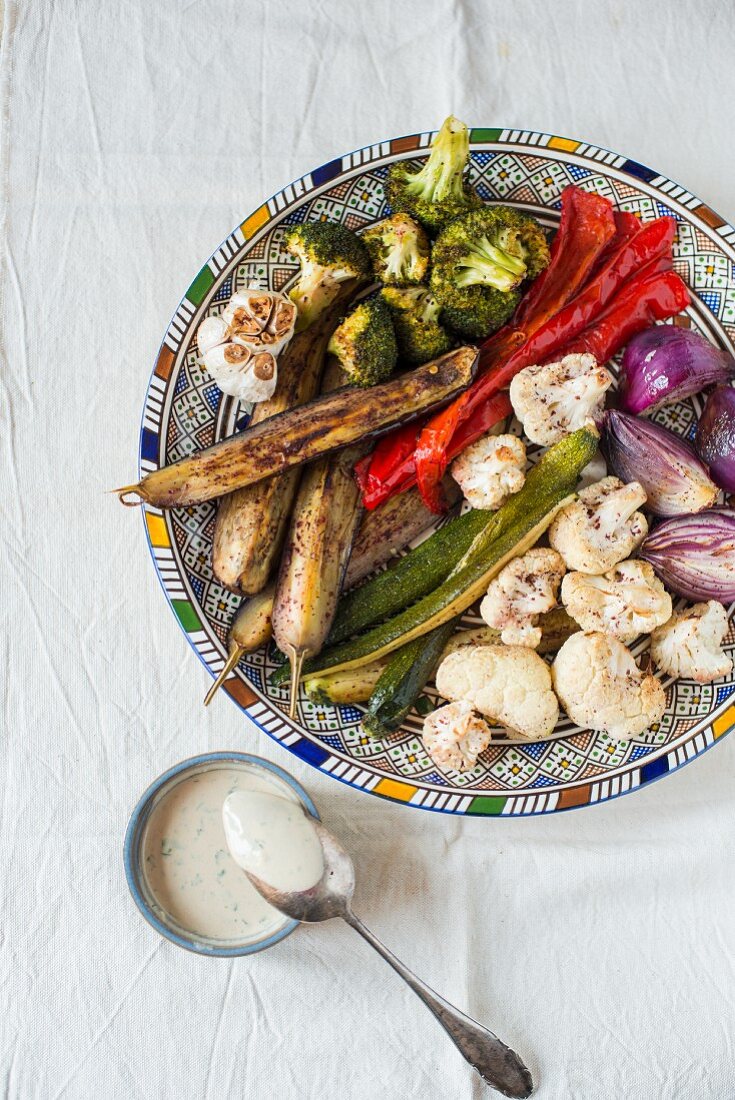 Barbecued vegetables with a dip made of tahini and sumak (view from above)