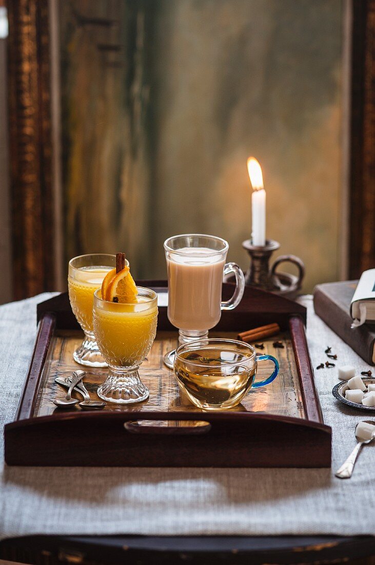 Three assorted winter hot drinks on a tray