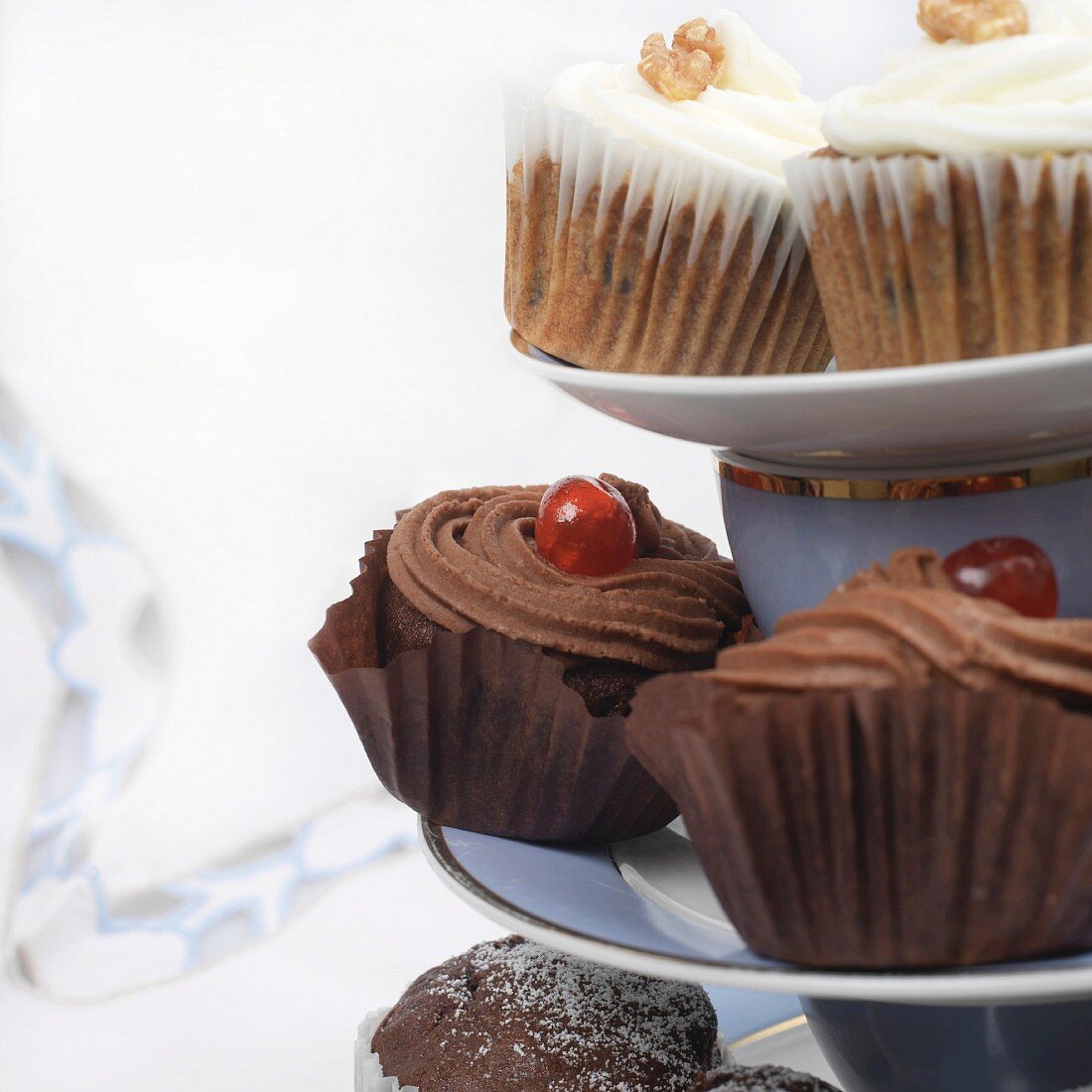 Assorted cupcakes and muffins on a cake stand (section)