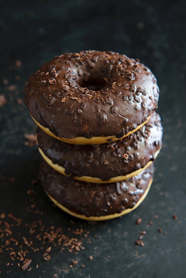 Three doughnuts with chocolate glaze