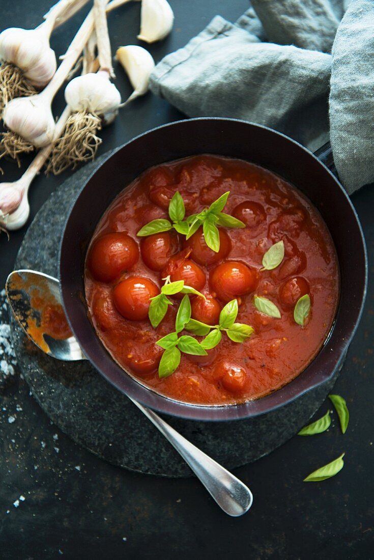 Tomato sauce with whole cherry tomatoes (view from above)