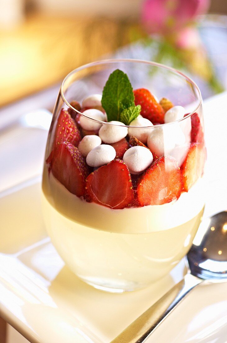 Panna cotta with elderflower jelly and strawberries