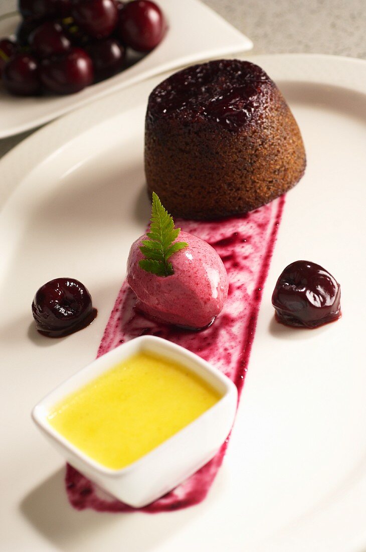 Steamed cherry pudding with cherry ice cream and custard