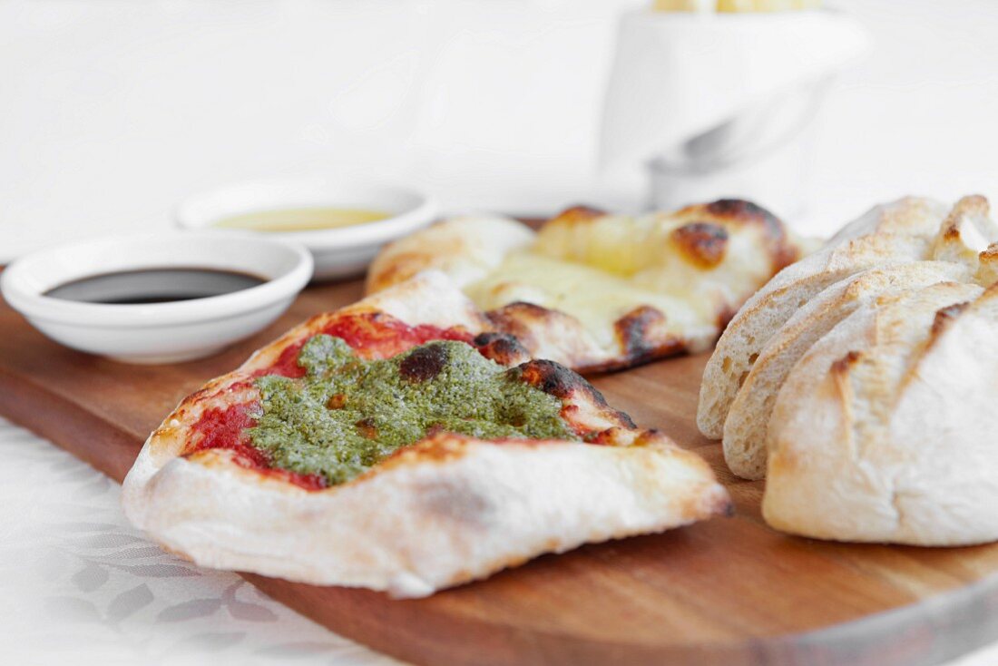 Assorted breads with pesto and olive oil
