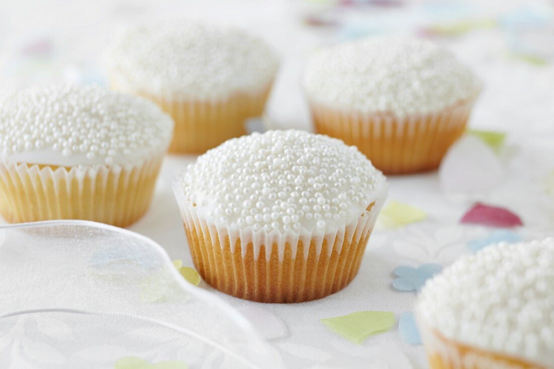 Cupcakes decorated with sugar pearls for a wedding
