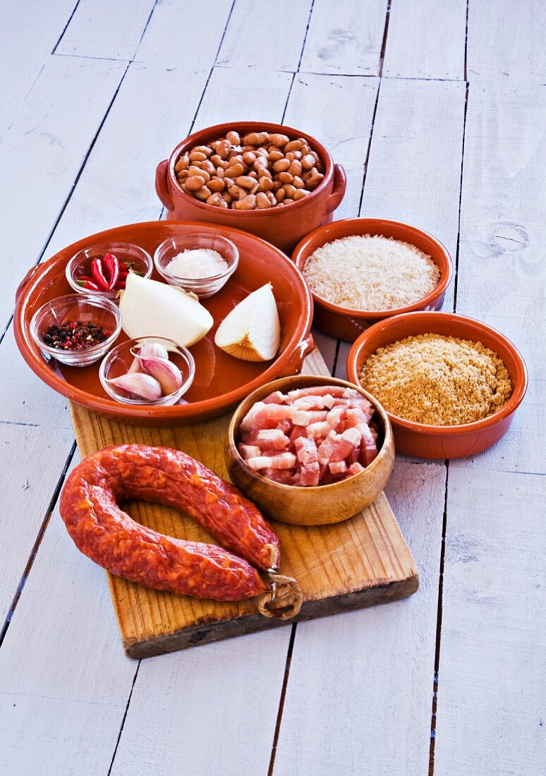 A mixed still life featuring foods from Spanish cuisine