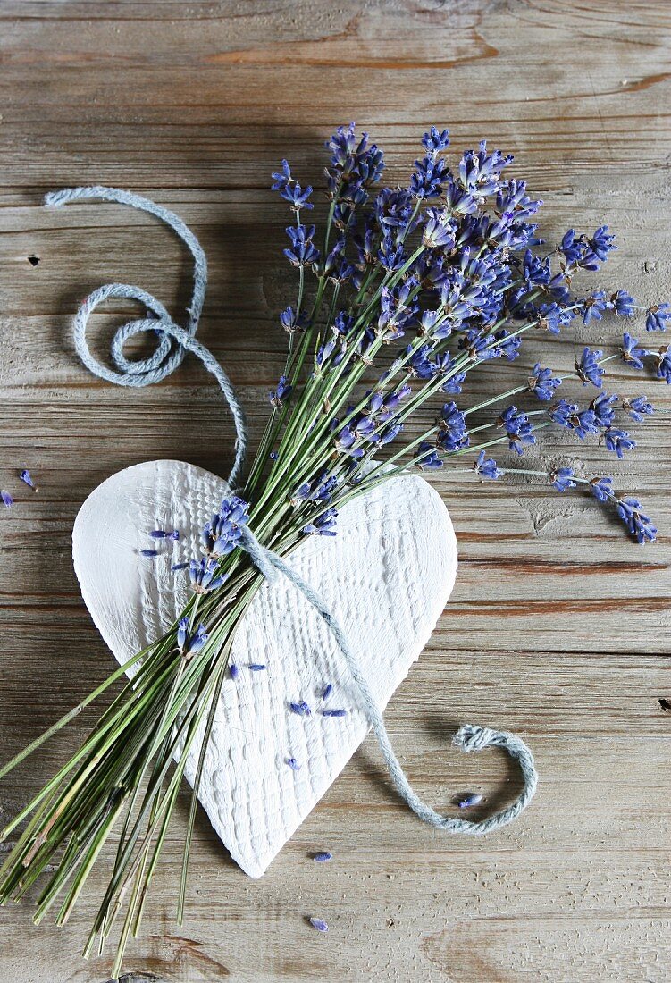 Modelling clay heart and bunch of lavender tied with cord