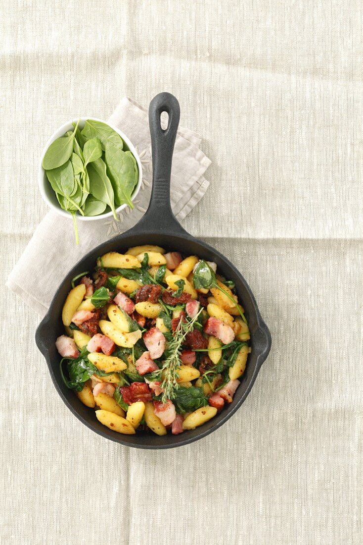 Gnocchi with bacon, spinach, sundried tomatoes and herbs